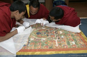 Thangkha restoration by Bhutanese monks