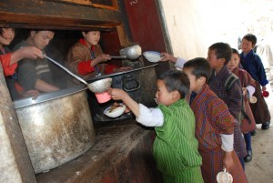 School Children line up for their midday meal.